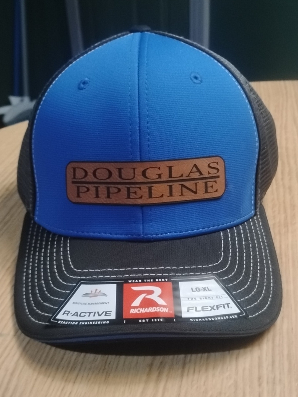 Douglas Pipeline Blue and Black Trucker Hat by